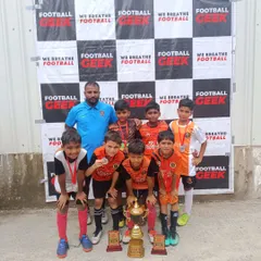 Our U11 team celebrating their championship win at the Independence Cup.