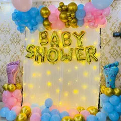 A traditional baby shower backdrop with "Baby Shower" foil balloons. The setup uses pink and blue balloons, perfect for a gender reveal party or a neutral theme.