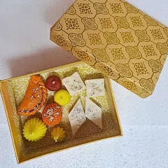 A box of pure, calorie-free indulgence. This Mithai Candle Box features an assortment of our most popular sweet-inspired designs, including Gujiya, Ladoo, and Kaju Katli candles. It makes for a truly unique and memorable gift for Raksha Bandhan or Diwali.