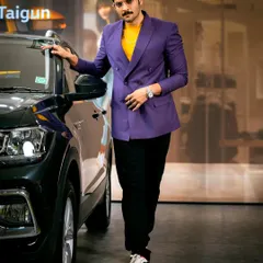 A commercial shoot with actor Ali Fazal. The styling with the bold purple jacket and the confident pose next to the car create a polished and professional advertising image.