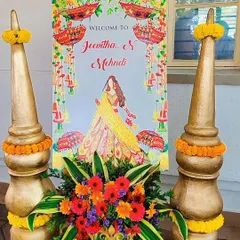 A welcome sign for a Mehendi ceremony. The bright and colorful design matches the festive theme of the event.
