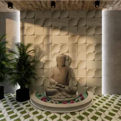 A close-up of the serene focal point at the clinic's entrance. A stone Buddha statue sits in a small water body, set against a 3D-paneled wall with vertical accent lighting, designed to create a calming first impression for visitors.