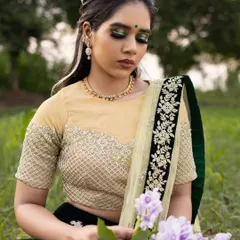 This image shows how the creative makeup look is integrated into a full concept for a photoshoot, from the outfit to the natural, outdoor setting.