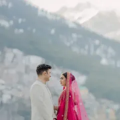 Against the vast, misty mountains of Manali, they share a look. It's a quiet, powerful moment that speaks of a love as grand as the landscape around them.