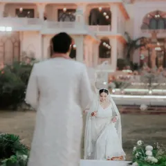 The bride's joyful walk towards her forever. We capture the anticipation and excitement in the moments leading up to the main ceremony, as Ria approaches Rahul.