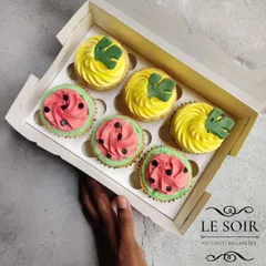 A fun tropical theme for a first birthday party. I designed these vanilla cupcakes to look like mini watermelons and pineapples using colored buttercream and tiny fondant details.