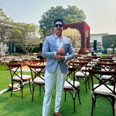 A moment before the guests arrive for an outdoor daytime wedding ceremony. The elegant setup on the lush green lawn provides a beautiful and serene backdrop for the event ahead.