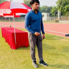 On the field at Tau Devi Lal stadium, stopwatch in hand, ready for a day of training. I am always prepared to measure progress and push my athletes.