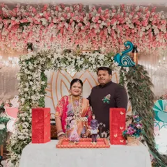 Kajal and her husband at their baby shower, holding the custom-made dolls we created to look just like them. It's a perfect, personal touch for any celebration.
