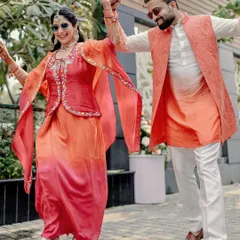 A high-energy, dancing shot that is full of life. Their coordinated outfits and joyful expressions make this a perfect candid moment. This is what happens when we let go of stiff poses and just have fun.