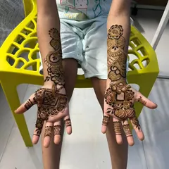 A lovely Eid henna design for a child. The patterns are simpler and spaced out, making it a comfortable and fun experience for the little ones during festive celebrations.