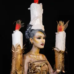 We encourage our students to push their creative limits with fantasy and SFX makeup. This stunning candle-inspired look demonstrates advanced techniques in body painting, prop integration, and character creation.