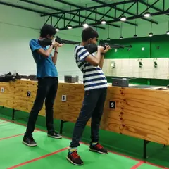 Young shooters trying out air rifles for the first time during a recreational session. We provide basic instruction on safety and technique for all beginners.