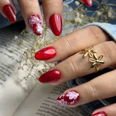Created for a client celebrating Durga Ashtami, this festive set combines a powerful Red Cat Eye polish with delicate hand-painted floral accents. It’s a beautiful blend of tradition and modern nail art, perfect for any cultural celebration.