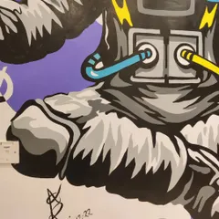 A look at the lower half of the astronaut mural, including my signature. This custom wall painting for an educational space shows how art can make any environment more dynamic.
