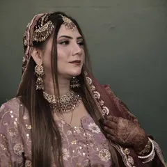 This bride is wearing a beautiful lavender outfit with her hair styled long and straight. The focus is on the intricate passa and other jewelry that I carefully placed to complete her look.