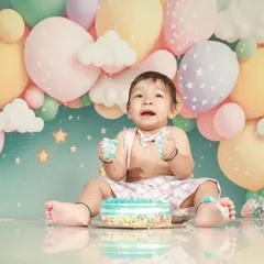 This pre-birthday photoshoot is full of smiles and cake! I love the pastel balloon backdrop for a soft and dreamy celebration.