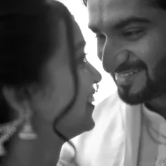 Sometimes, the most powerful stories are told without color. This black and white portrait captures a simple, honest connection between the couple, focusing purely on their expressions and the love they share. It's an example of our artistic approach to wedding photography.