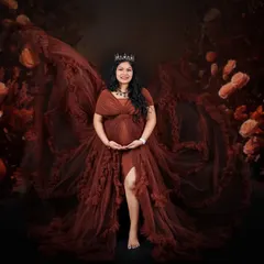 Our dramatic brown gown is perfect for creating powerful, queenly portraits. Here, the fabric is fanned out to create a stunning "wing" effect.