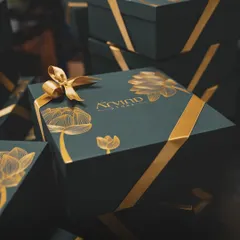 We excel in creating bespoke corporate gifts that reflect your brand's elegance. Here is a custom-designed luxury hamper for Arvind Store, featuring deep green boxes with gold foil and satin ribbons for a truly premium feel.