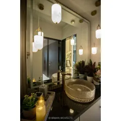 A close-up of the crystal-cut basin and gold tap. We believe that using beautiful, high-quality fixtures can transform a simple wash area into a statement of luxury.
