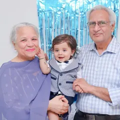 The warmth of a grandparent's love is a special thing. We love creating these beautiful portraits that show the precious bond between generations.