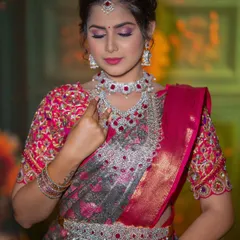 A beautiful American diamond set with ruby-colored stones. This is a great way to add a pop of color to your reception look.