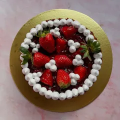 You can't go wrong with a classic strawberry cake. This beauty is topped with a generous amount of fresh strawberries and whipped cream, a perfect treat while the season lasts.