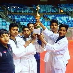 Our junior team celebrating with their championship trophy. This victory is a result of their collective hard work, discipline, and team spirit.
