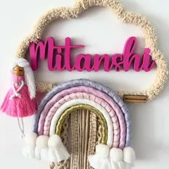 This custom piece for Mitanshi features a beautiful pastel rainbow, a textured cloud frame, and an adorable handmade doll. It's a whimsical and personal design that brings so much character to a little one's room.