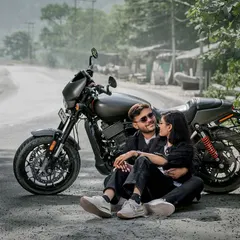 For the couple with a bit of an edge. Posing with a Harley on a mountain road, this shot is all about cool, adventurous vibes. Perfect for telling a different kind of love story.