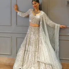 Another look at our stunning all-over silver sequin lehenga. This piece is high-quality, fits beautifully, and guarantees you will look and feel amazing at your reception or sangeet.