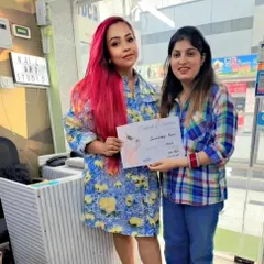 Celebrating a student's completion of the course. Seeing them ready and confident to take on clients is the most rewarding part of my job.