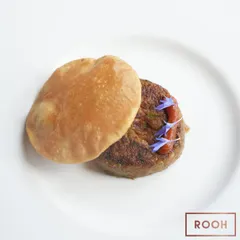 A classic from the Lucknowi pop-up: succulent Shami Kabab served with a fluffy poori. A simple, yet profoundly flavorful dish that speaks of tradition.