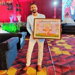 Holding the completed live wedding painting. It was a challenging but rewarding experience to create this piece live during a grand wedding event.