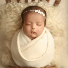 Even at two months old, we can achieve beautiful, sleepy portraits. This sweet girl was colicky, but with patience and my calming techniques, we captured this serene moment in just 90 minutes.