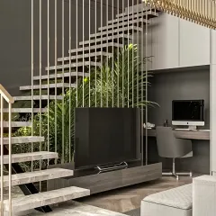 We excel at creating solutions for unique architectural features. Here, we designed a media unit and a compact home office desk to fit perfectly under a modern staircase, maximizing usable space.