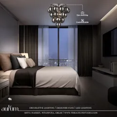 A modern cluster of smoked glass globes hangs like a piece of jewelry in this moody, contemporary bedroom. This customizable fixture is where luxury begins, creating a dramatic and personal statement.