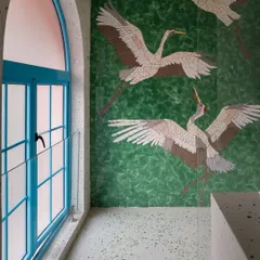 This bathroom features a stunning custom mosaic wall depicting cranes in flight. It is an example of how I integrate art directly into the architecture, turning a functional wall into a captivating focal point.