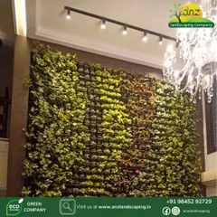 We bring nature indoors with luxurious vertical gardens. This installation in an office lobby uses a variety of plant species to create a living wall that acts as a natural focal point, enhanced by elegant track lighting.