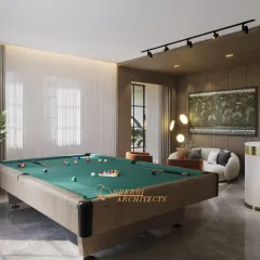 A view across the pool table, highlighting the track lighting and the natural light from the large windows.