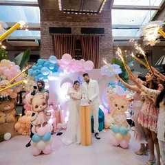 A magical cake-cutting moment, with the couple surrounded by loved ones holding sparklers. This is what a celebration is all about: creating a circle of light and love.