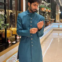 Just fixing my cuff. Another look at this smart sherwani, perfect for any sangeet.