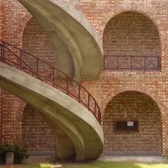 A throwback to our Vidyagram project in Haryana. The sculptural concrete staircase contrasts beautifully with the traditional brickwork and arches, showcasing our early exploration of blending modern forms with vernacular charm.