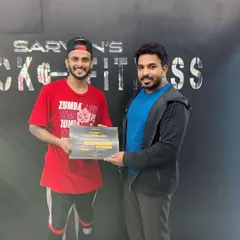 It's always an honor to be recognized for my work. Here I am receiving a "Best Performer" certificate at a Zumba fitness event, a testament to the passion I put into every class.