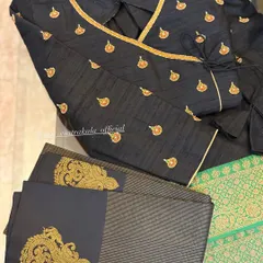 Another view of the black angrakha blouse, showing the elegant wrap design and the intricate zardosi work on the accompanying fabric.