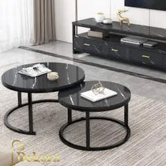 We designed this modern nesting coffee table set for flexible living spaces. Featuring two round tables with a black marble-finish top and minimalist black metal frames, they can be used together or separately to adapt to your needs.