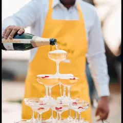 A classic champagne tower is the epitome of celebration, and we love creating these elegant centerpieces. We meticulously build the tower and handle the pour, ensuring a picture-perfect moment for your toast.