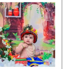 A beautiful, calm moment captured during a Little Krishna photoshoot. The baby sits peacefully amidst a colorful and divine setting, creating a truly special memory.