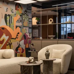 Another angle of the office mural, highlighting its integration with the shelving and seating area. The composition flows across the wall, engaging with every element of the interior design.